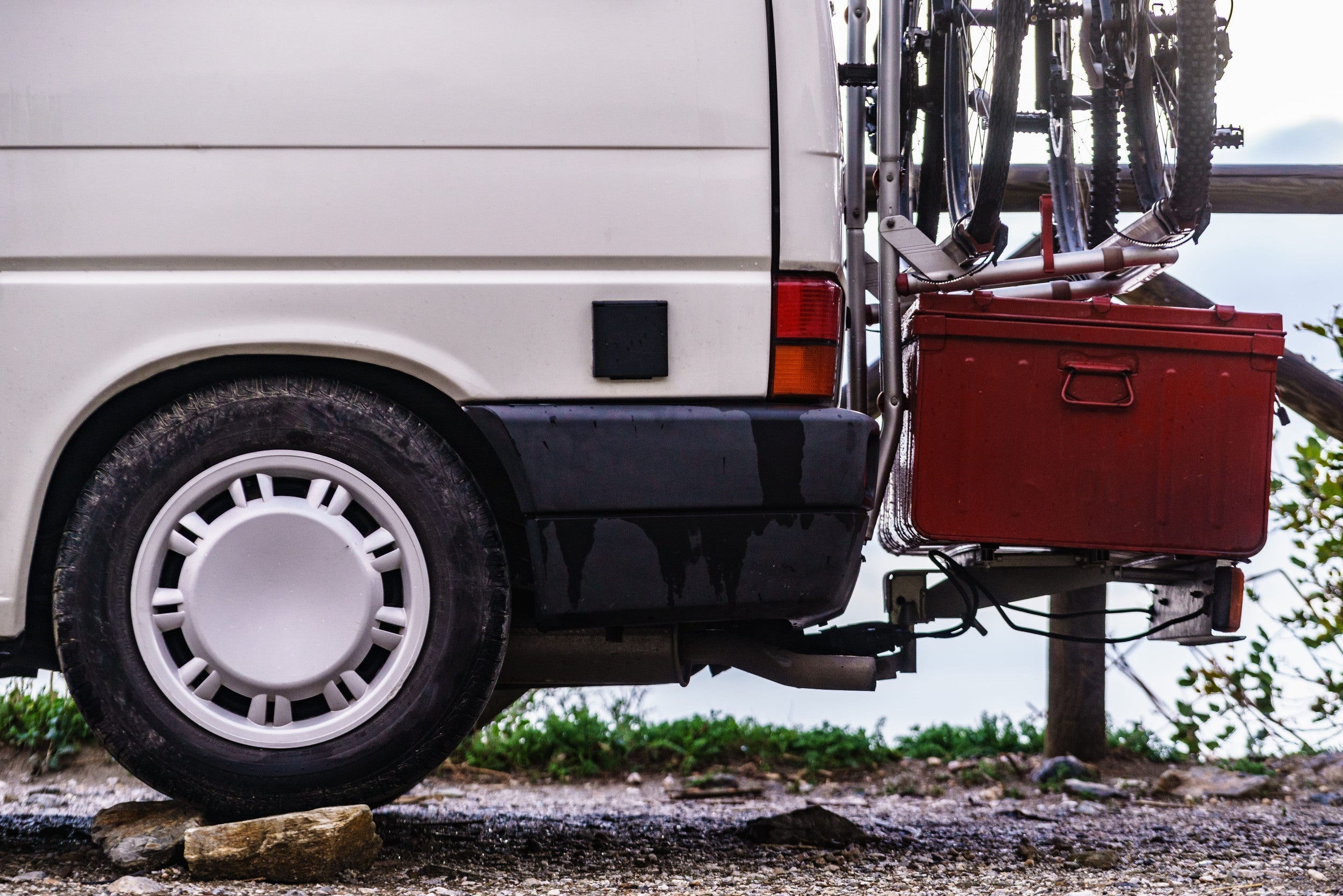 Van with storage box and bicycle racks attached