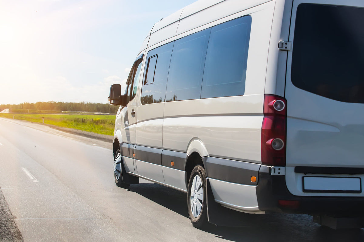 Sprinter van driving down the road