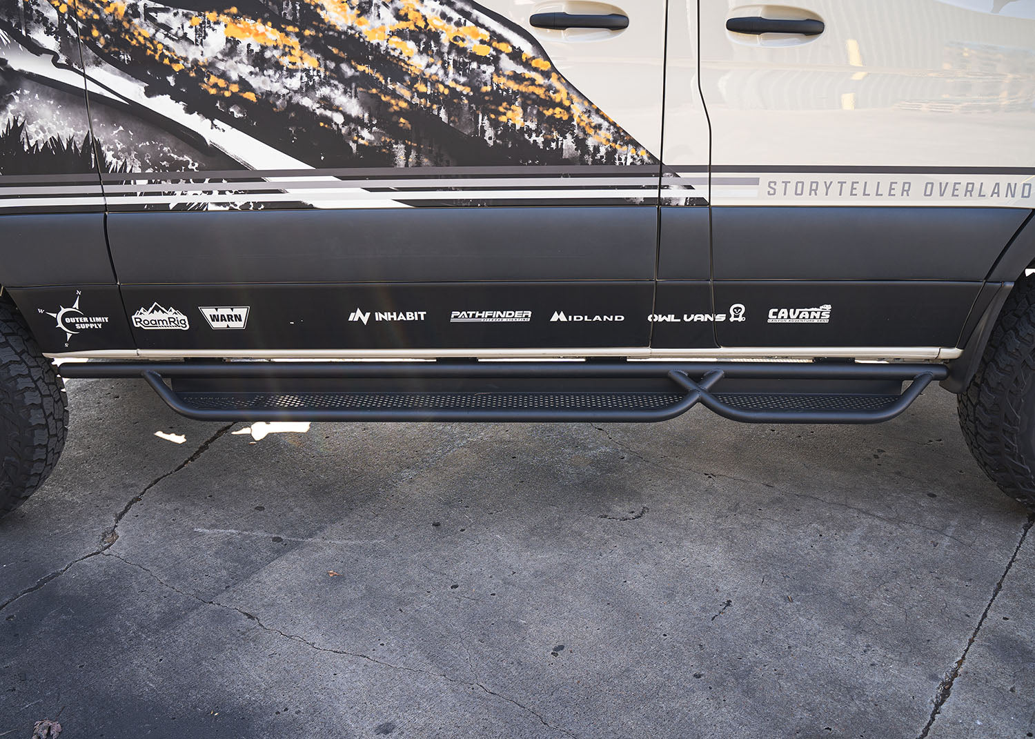 Top-down view of the full ROAMBUILT Passenger Side Tube Step installed along the entire length of the Sprinter van’s passenger side.