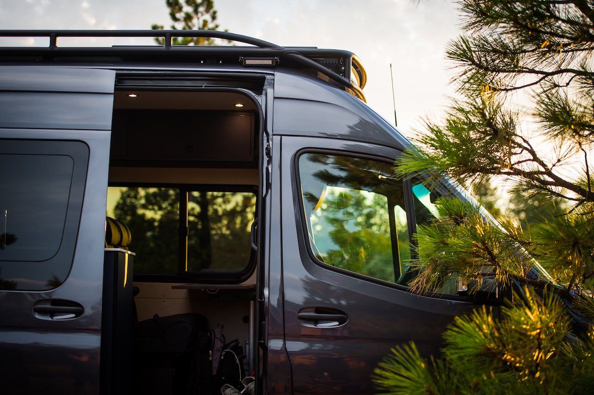 Close-up of the SafariRack 2.0 SLB showing the front curve and side angle details, highlighting the aerodynamic design and perforated aluminum decking.