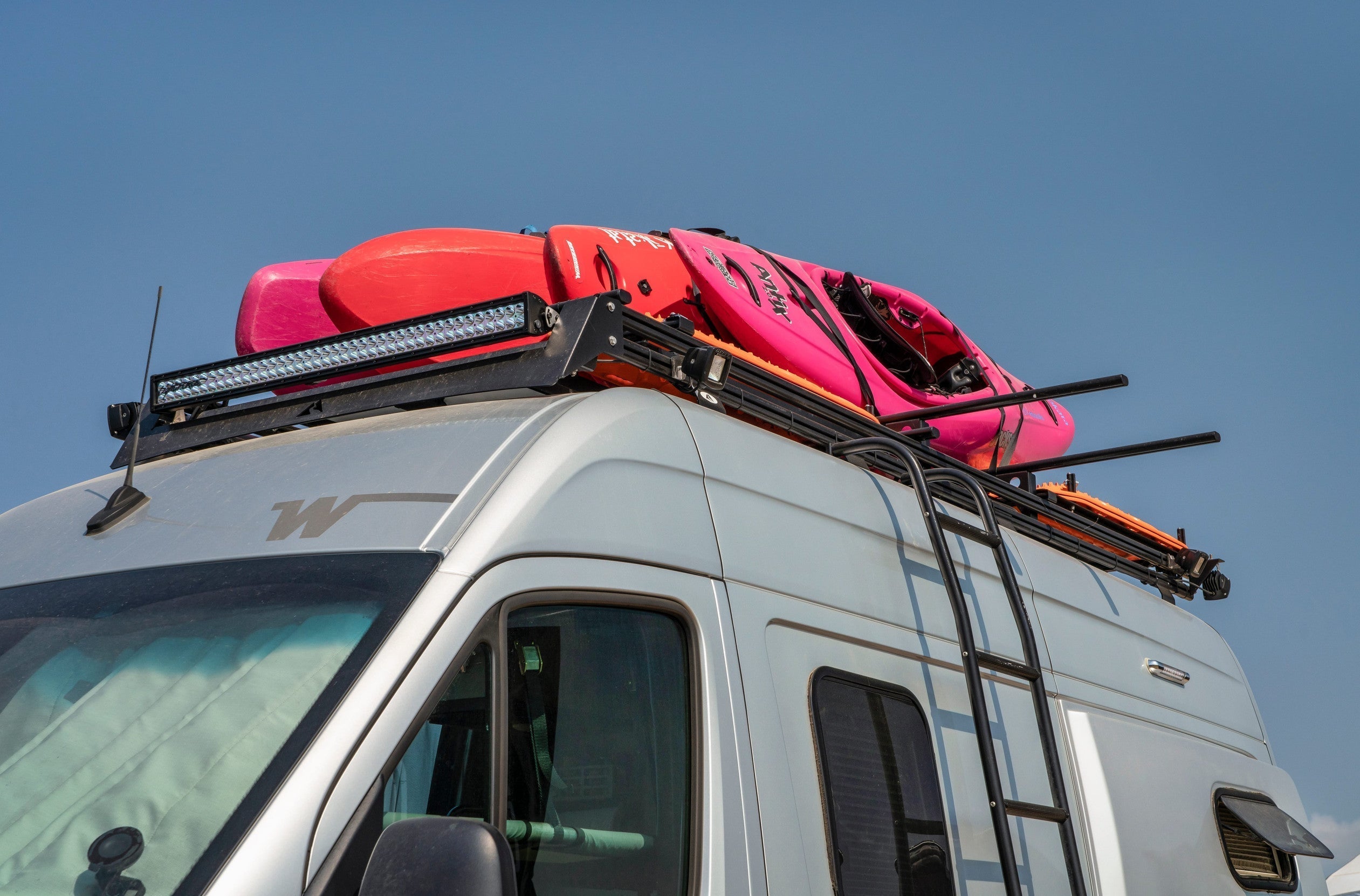 Kayaks in a roofrack on top of a van